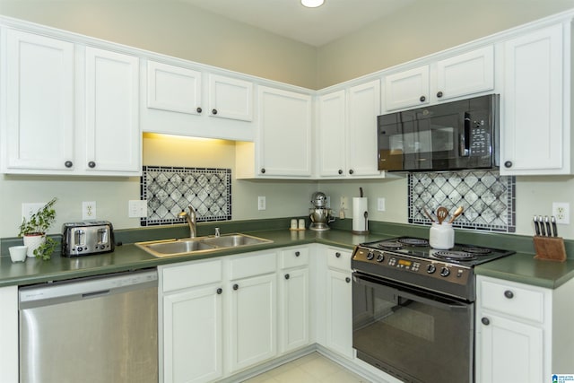 kitchen featuring a sink, dark countertops, black appliances, and white cabinetry