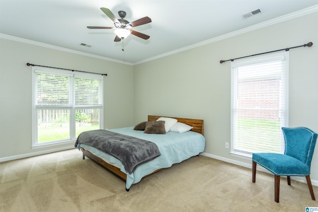 bedroom with baseboards, light colored carpet, ornamental molding, and visible vents