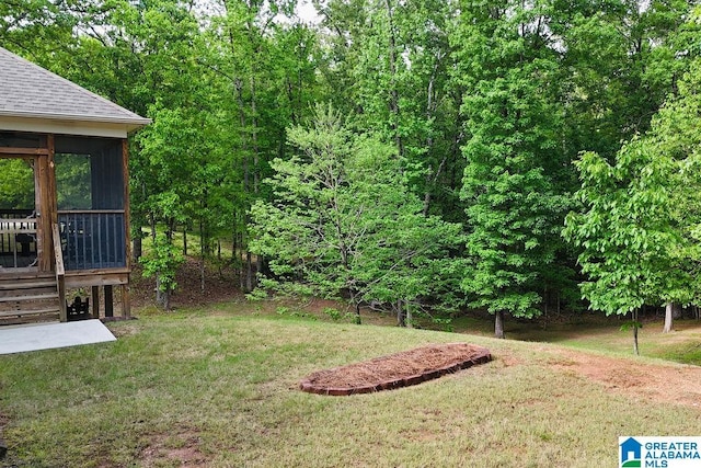view of yard with a sunroom, a wooden deck, and stairs