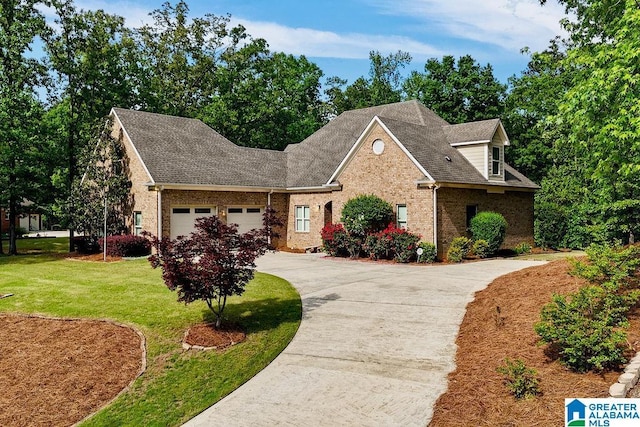 view of front facade featuring a garage, a front lawn, brick siding, a shingled roof, and concrete driveway