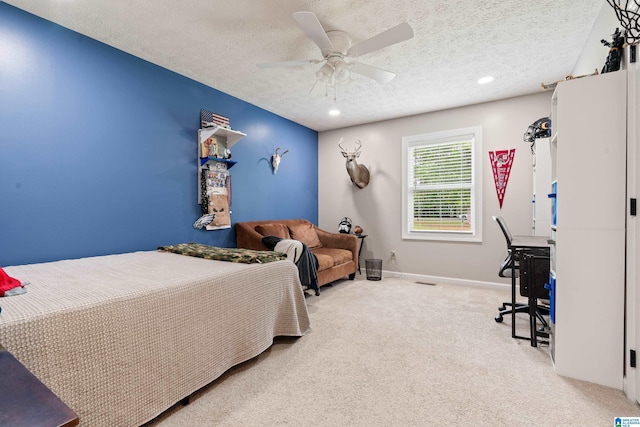 bedroom featuring recessed lighting, a ceiling fan, a textured ceiling, and carpet flooring
