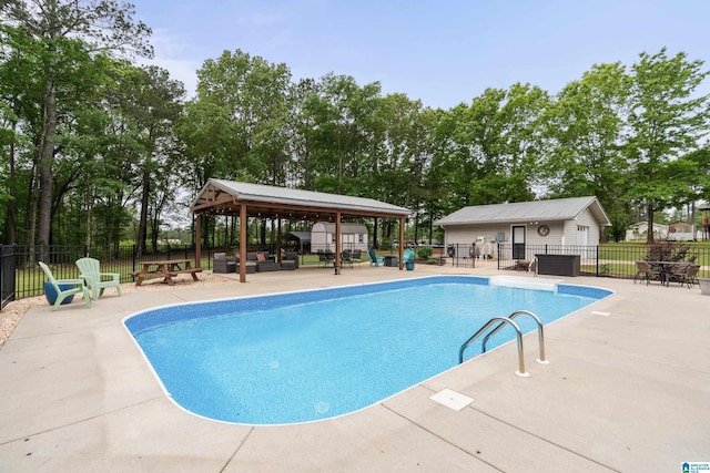 view of swimming pool with fence, a gazebo, a fenced in pool, and a patio area