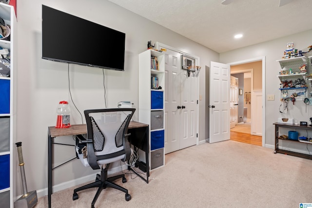 office space with baseboards, recessed lighting, and carpet