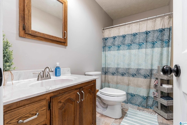 bathroom featuring a textured ceiling, vanity, toilet, and a shower with curtain