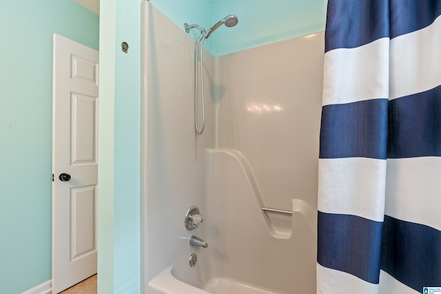 full bathroom featuring shower / bath combo with shower curtain