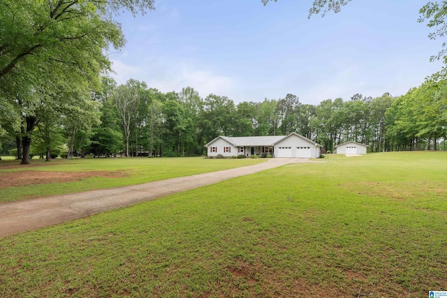view of front facade with concrete driveway, a front lawn, and a garage