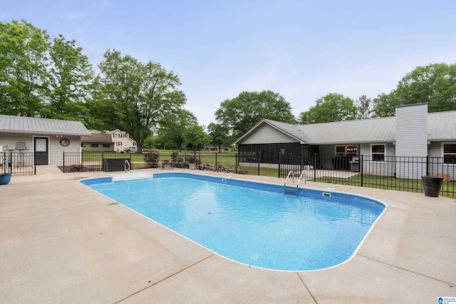view of pool with a patio, a fenced in pool, and fence