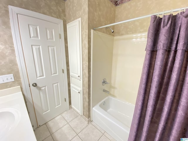 full bathroom with wallpapered walls, shower / bath combination with curtain, tile patterned flooring, and vanity