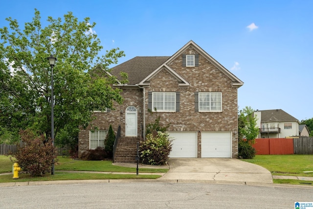 300 Stonecreek Cir, Helena, AL 35080 - view of front of home featuring a front lawn, a garage, brick siding, concrete driveway, and fence