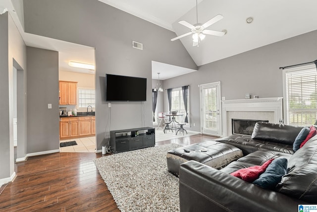 300 Stonecreek Cir, Helena, AL 35080 - living area with visible vents, ceiling fan, dark wood-style floors, a fireplace, and high vaulted ceiling