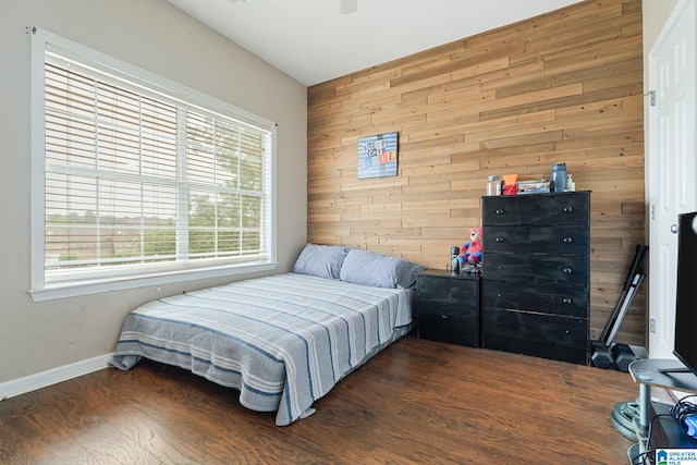 300 Stonecreek Cir, Helena, AL 35080 - bedroom with wooden walls, multiple windows, wood finished floors, and baseboards