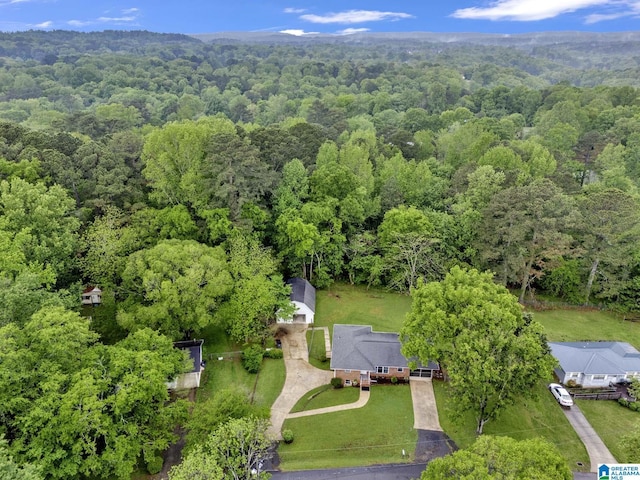 bird's eye view featuring a wooded view
