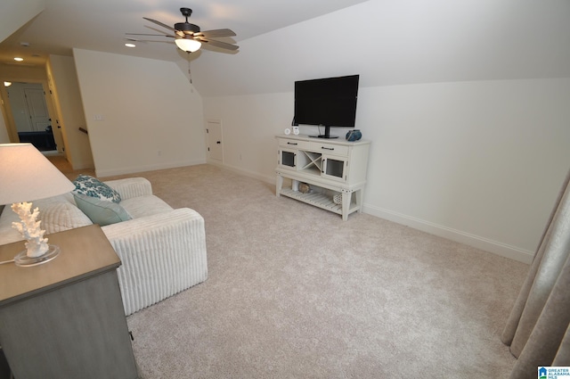 living room featuring lofted ceiling, light colored carpet, baseboards, recessed lighting, and a ceiling fan