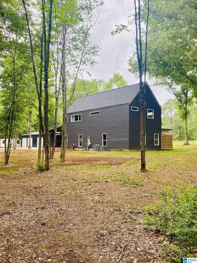 view of side of property with central AC unit