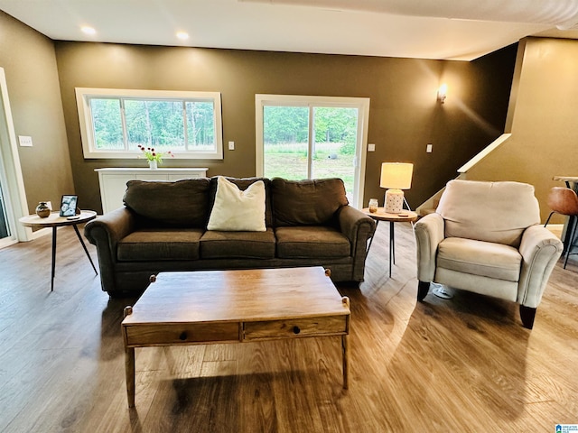 living area with recessed lighting and wood finished floors