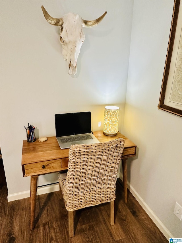 office featuring baseboards and wood finished floors
