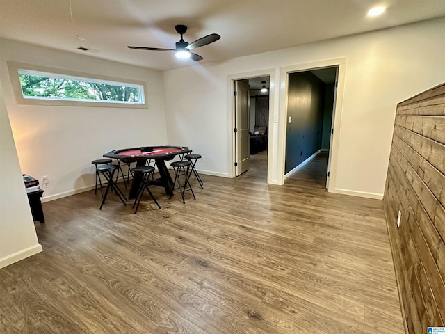 dining room featuring visible vents, ceiling fan, wood finished floors, and baseboards