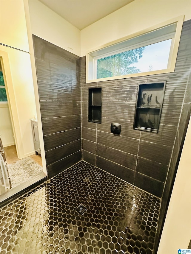 full bath with tiled shower