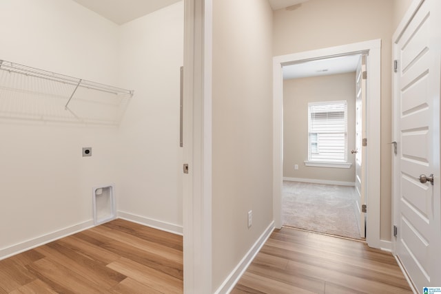 3757 Seaside Sparrow Cir, Bessemer, AL 35022 - laundry area with light wood finished floors, electric dryer hookup, laundry area, and baseboards