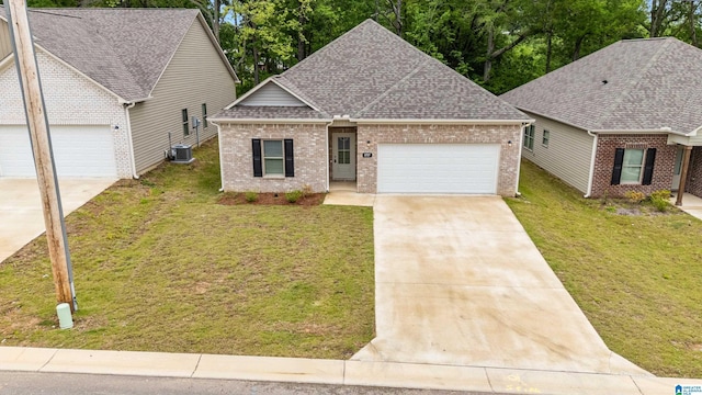 3757 Seaside Sparrow Cir, Bessemer, AL 35022 - view of front of property featuring a garage, brick siding, driveway, and roof with shingles