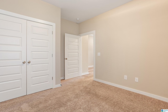 3757 Seaside Sparrow Cir, Bessemer, AL 35022 - unfurnished bedroom featuring a closet, baseboards, and carpet floors