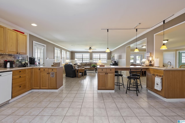 kitchen featuring light tile patterned flooring, a breakfast bar, a peninsula, open floor plan, and backsplash