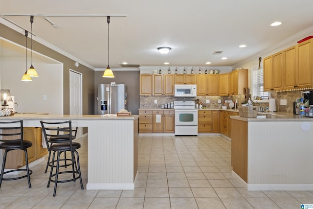 kitchen featuring white appliances, backsplash, and crown molding