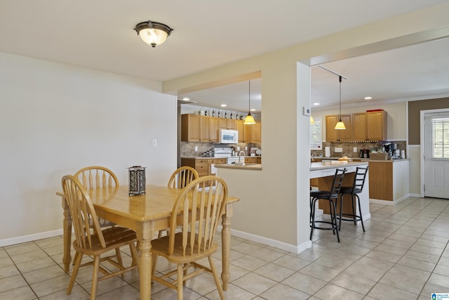 dining room with light tile patterned floors and recessed lighting