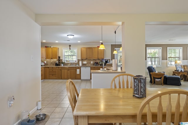 dining space featuring crown molding, light tile patterned flooring, and recessed lighting