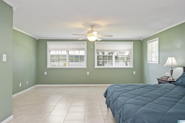 bedroom with crown molding, a ceiling fan, baseboards, and light tile patterned floors