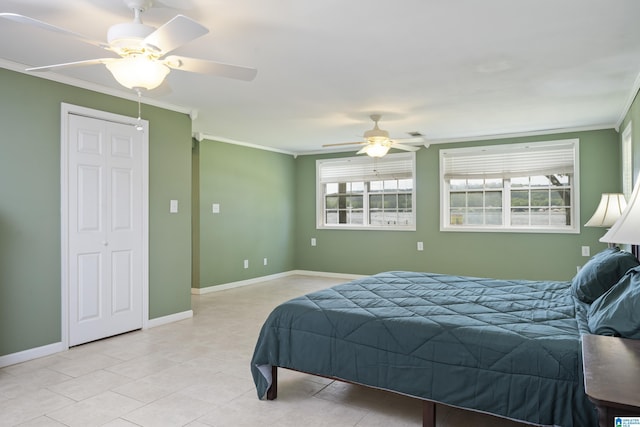 bedroom with crown molding, baseboards, light tile patterned floors, and a ceiling fan
