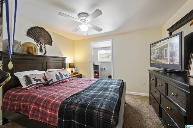bedroom with carpet flooring, baseboards, and ceiling fan