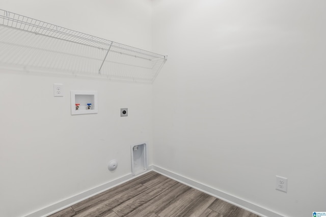 3769 Seaside Sparrow Cir, Bessemer, AL 35022 - clothes washing area featuring gas dryer hookup, electric dryer hookup, hookup for a washing machine, wood finished floors, and laundry area