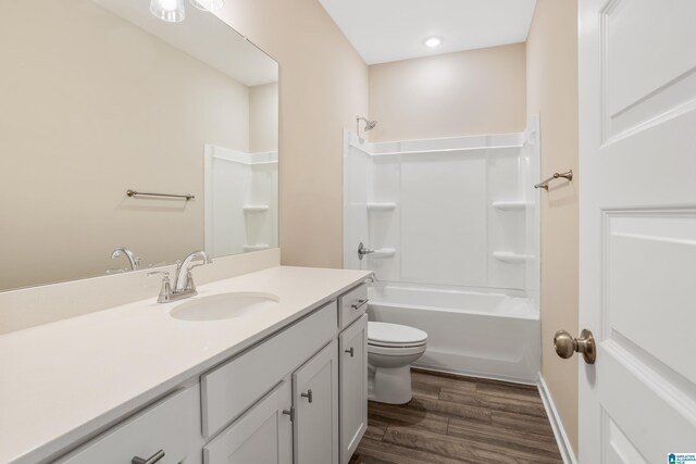 3769 Seaside Sparrow Cir, Bessemer, AL 35022 - bathroom featuring wood finished floors, toilet, vanity, and shower / bath combination