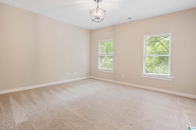 3769 Seaside Sparrow Cir, Bessemer, AL 35022 - unfurnished room featuring a notable chandelier, visible vents, light colored carpet, and baseboards