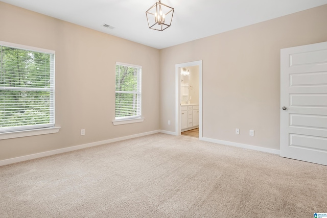 3769 Seaside Sparrow Cir, Bessemer, AL 35022 - unfurnished room with baseboards, visible vents, a notable chandelier, and light colored carpet