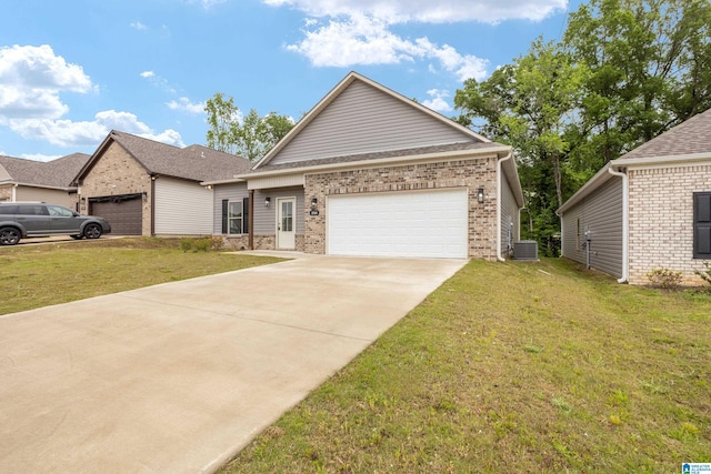 3769 Seaside Sparrow Cir, Bessemer, AL 35022 - view of front of house with an attached garage, concrete driveway, a front yard, and brick siding