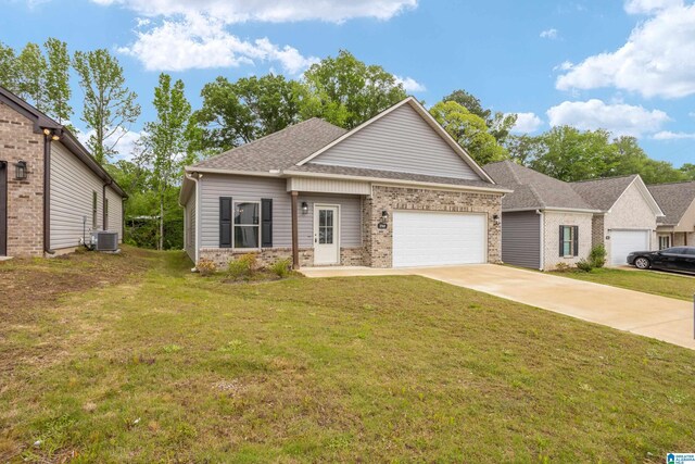 3769 Seaside Sparrow Cir, Bessemer, AL 35022 - ranch-style home with a shingled roof, central air condition unit, an attached garage, a front lawn, and brick siding