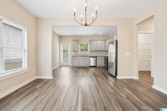 3769 Seaside Sparrow Cir, Bessemer, AL 35022 - kitchen with a sink, appliances with stainless steel finishes, a chandelier, wood finished floors, and gray cabinets
