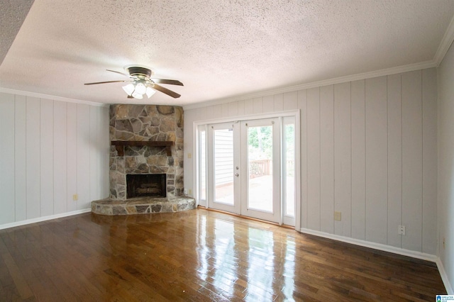 302 Old Rocky Ridge Ln, Birmingham, AL 35216 - unfurnished living room featuring a textured ceiling, wood finished floors, crown molding, and a ceiling fan