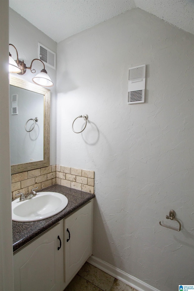 302 Old Rocky Ridge Ln, Birmingham, AL 35216 - bathroom featuring baseboards, visible vents, and vanity