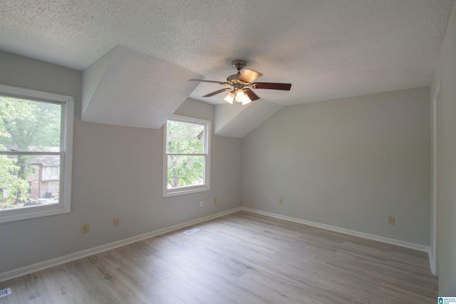 302 Old Rocky Ridge Ln, Birmingham, AL 35216 - bonus room featuring a textured ceiling, ceiling fan, baseboards, and light wood-style floors