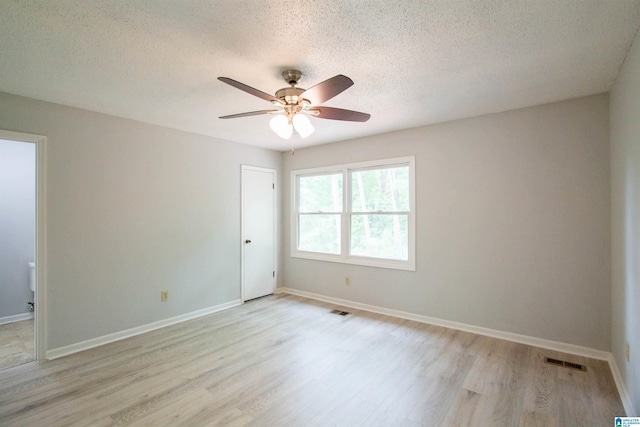 302 Old Rocky Ridge Ln, Birmingham, AL 35216 - empty room with a textured ceiling, visible vents, baseboards, light wood-type flooring, and a ceiling fan