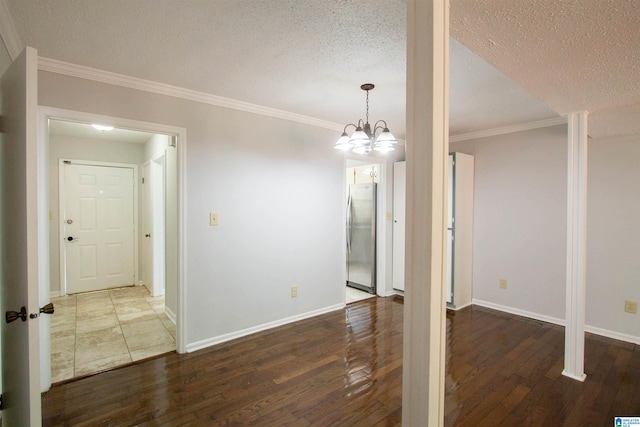 302 Old Rocky Ridge Ln, Birmingham, AL 35216 - unfurnished dining area with a chandelier, wood finished floors, a textured ceiling, and crown molding