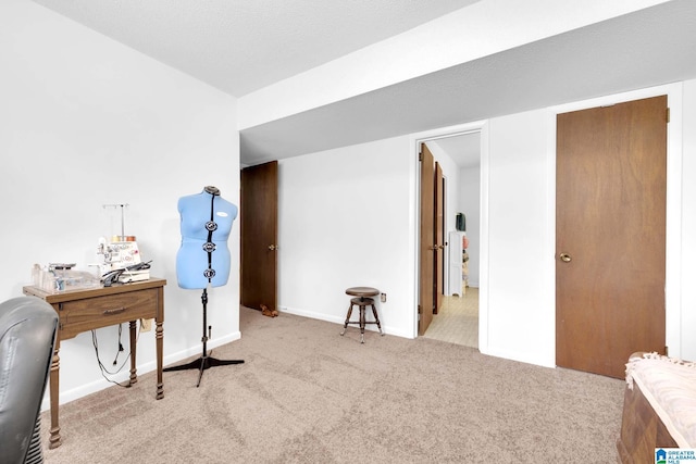 carpeted bedroom featuring baseboards