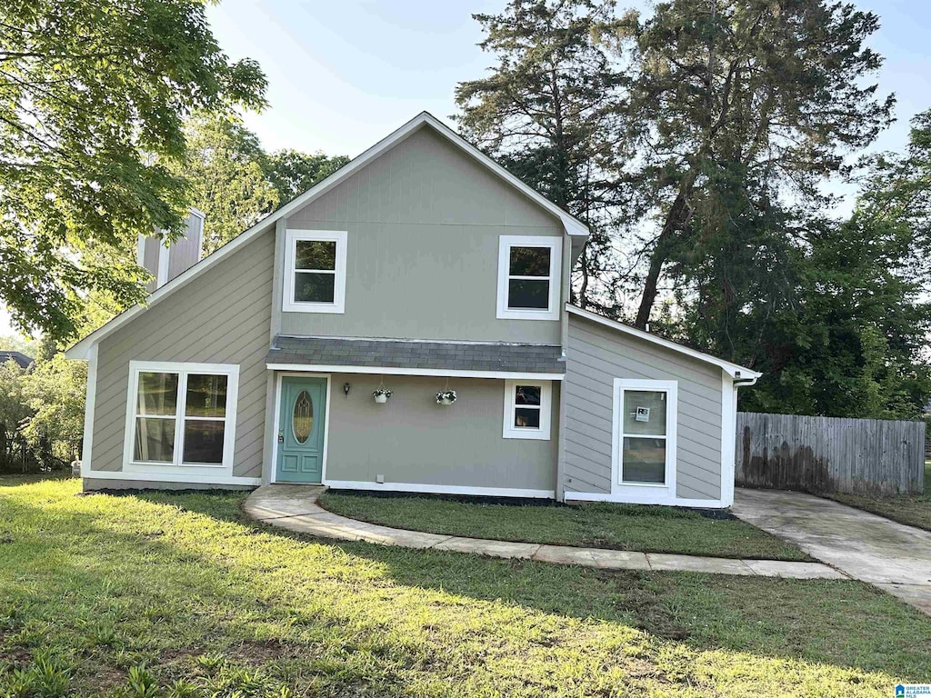 8520 Rockhampton St, Leeds, AL 35094 - rear view of property with a lawn, fence, and a chimney