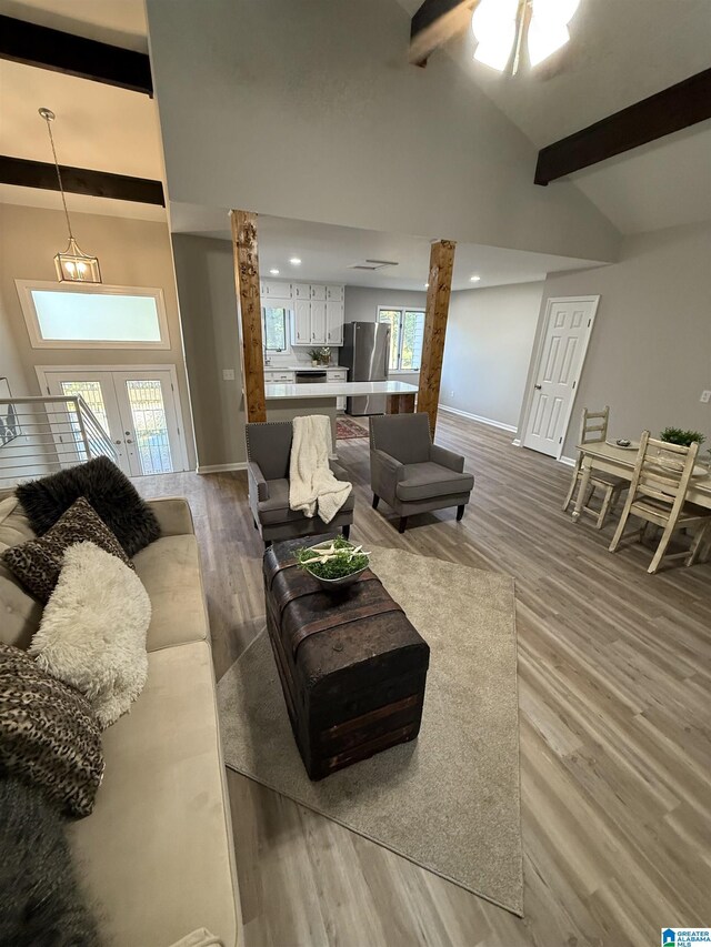 5600 Double Tree Cir, Birmingham, AL 35242 - living area with wood finished floors, baseboards, french doors, and a ceiling fan