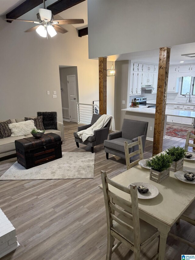 5600 Double Tree Cir, Birmingham, AL 35242 - living room with light wood-type flooring, a ceiling fan, and beamed ceiling