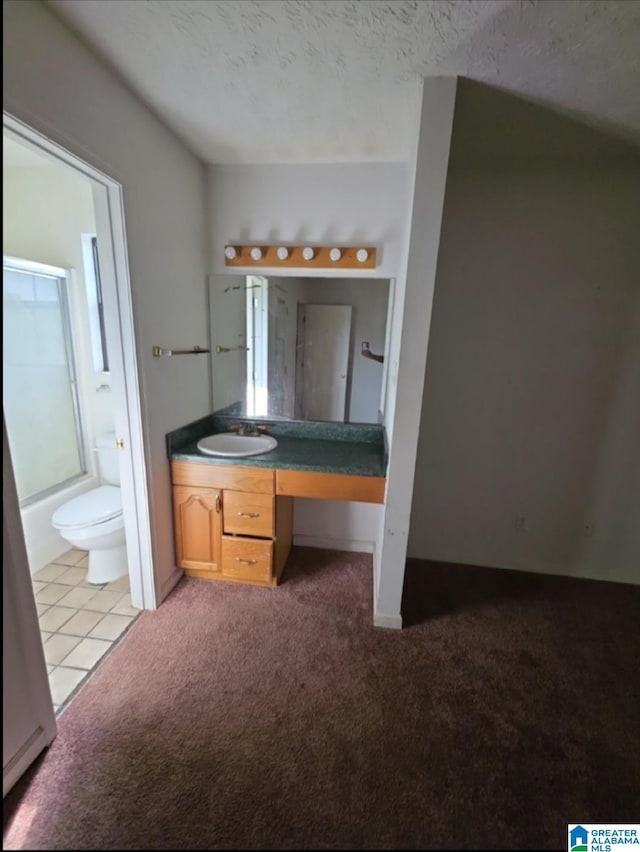 full bath featuring shower / bath combination with glass door, toilet, carpet flooring, and vanity