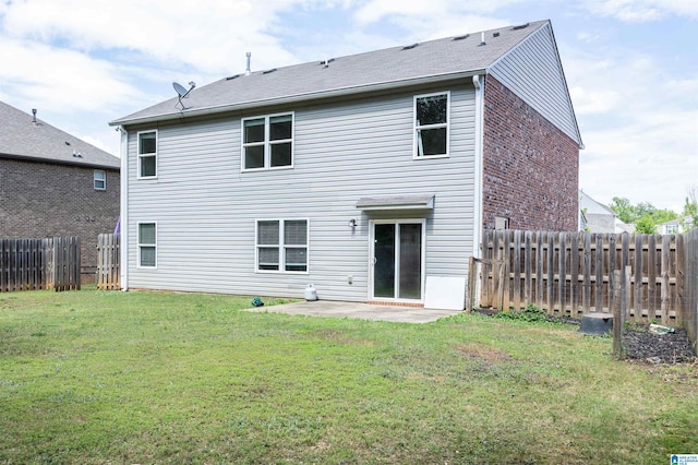 back of property featuring a patio and brick siding